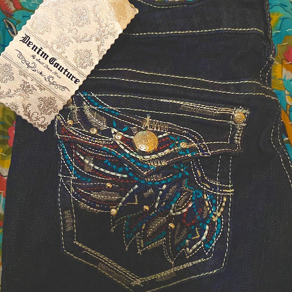 Denim couture jeans new with tags. Never washed or worn. Beautiful pockets!